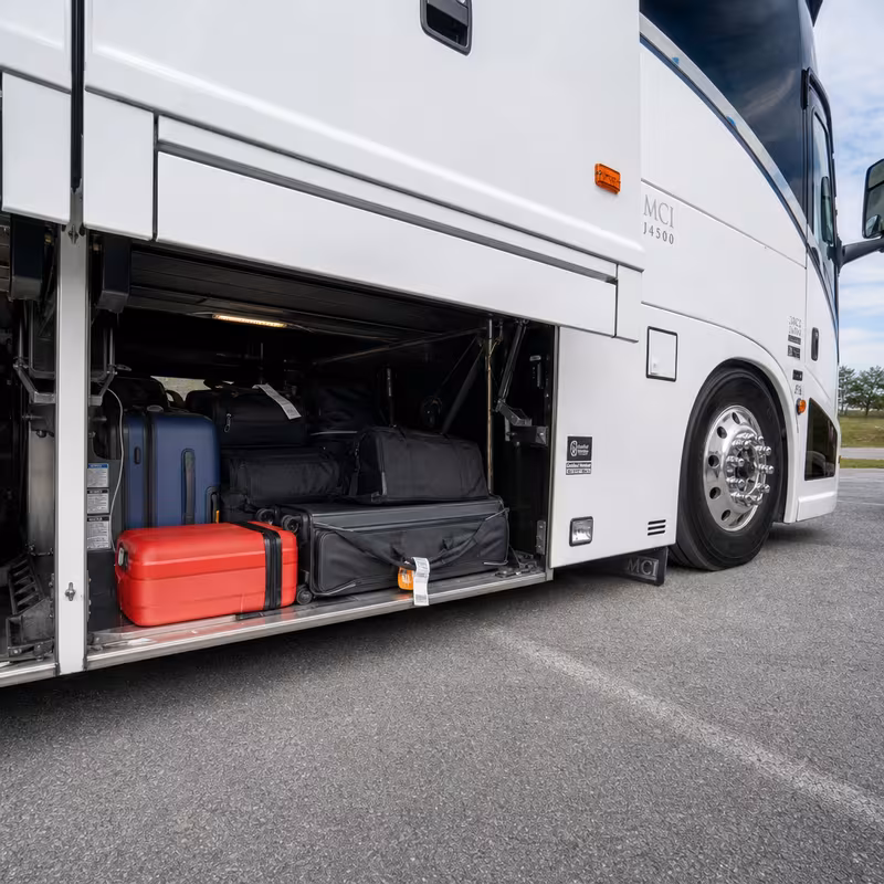 Party bus interior with wraparound leather seating and LED lighting in New York