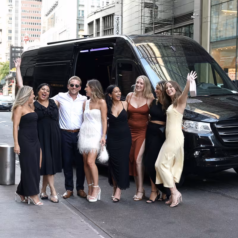 Group boarding a white charter bus for Bachelor & Bachelorette Transportation transportation in New York