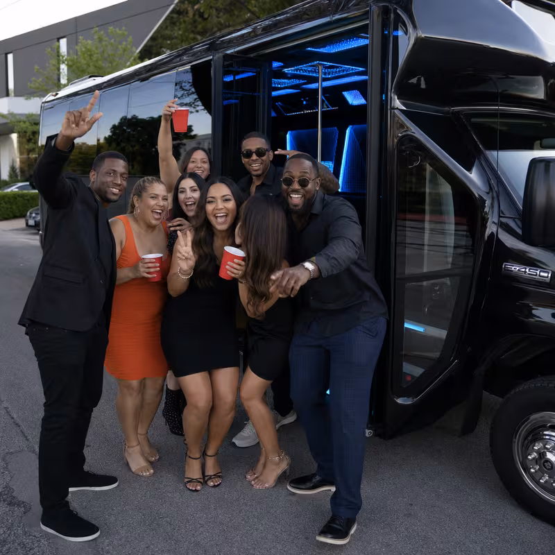 Group boarding a white charter bus for Birthday Transportation transportation in New York
