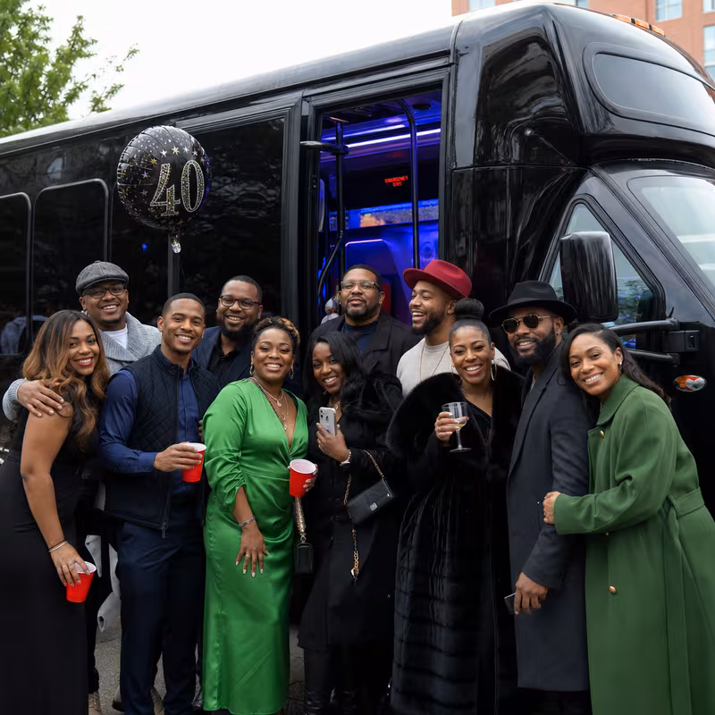 Party bus interior with wraparound leather seating and LED lighting in New York