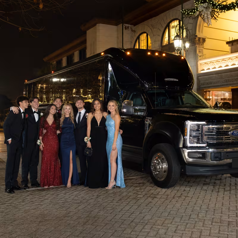 Party bus interior with wraparound leather seating and LED lighting in New York