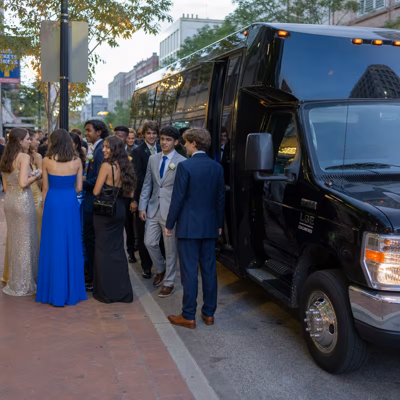 Passengers loading luggage while boarding an New York group shuttle